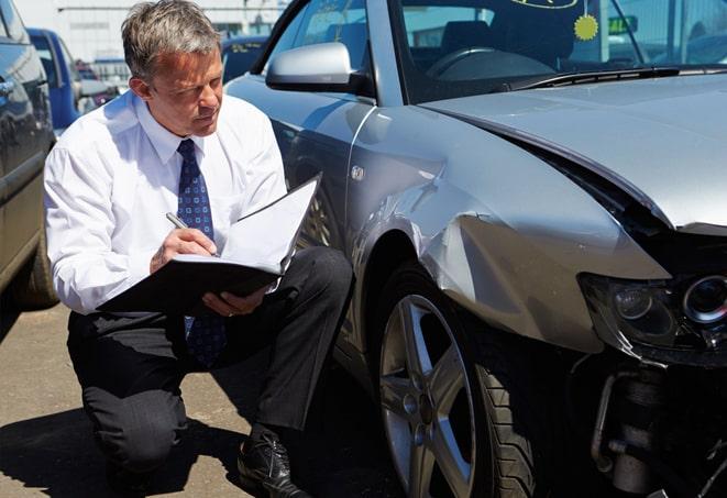 family reviewing auto insurance coverage at kitchen table